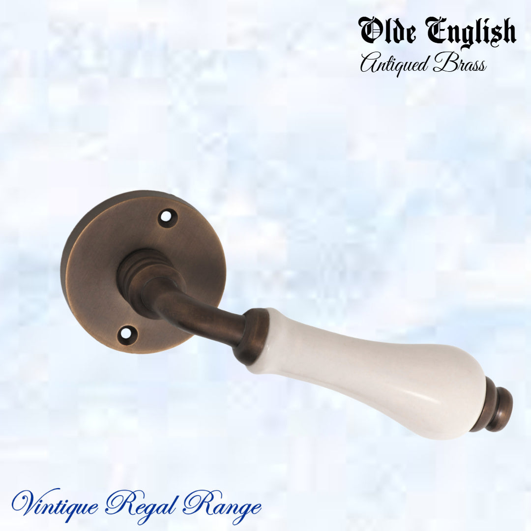 Antiqued Brass Olde English with Ivory Porcelain lever door handle-Vintique Concepts