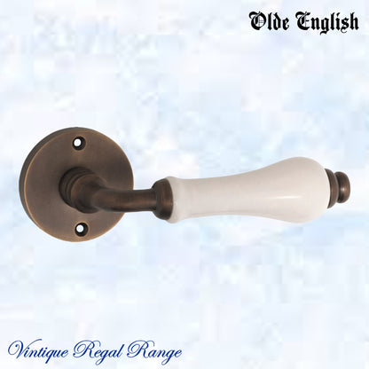 Antiqued Brass Olde English with Ivory Porcelain lever door handle-Vintique Concepts