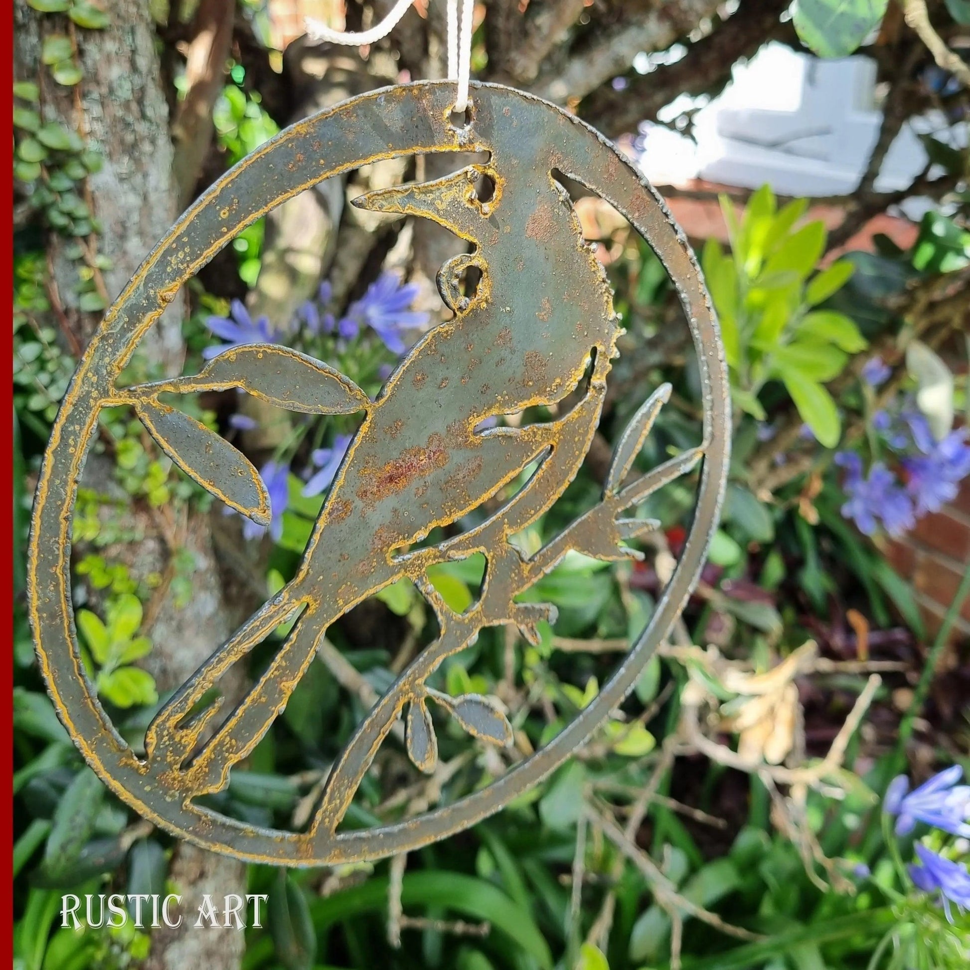 hanging Rusty Metal Bird TUI in circle approx 160mm in dia - Vintique Concepts