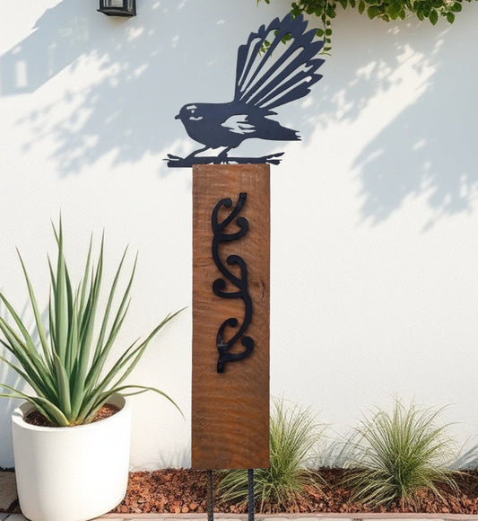 Black metal Pīwakawaka (NZ fantail) on Rustic Oak coloured Post Art-Vintique Concepts