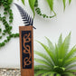 Black metal NZ Huruwhenua (Silver fern) on Rustic Oak Post-Garden Art-Vintique Concepts