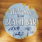 Welcome to our beach -Round beach Tin Sign-30cm dia-Vintique Concepts